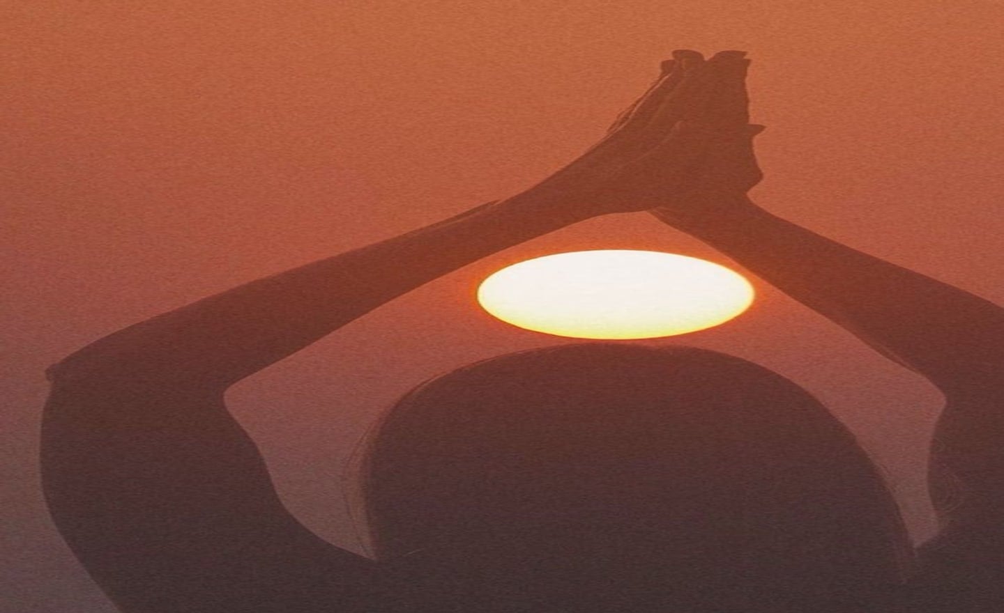 Hands raised toward the sun