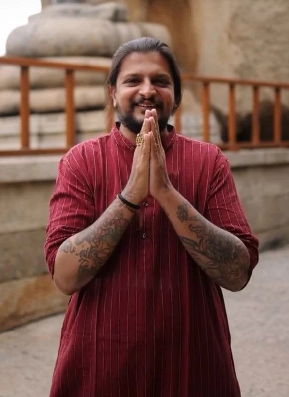Adiveda's founder greeting with folded hands