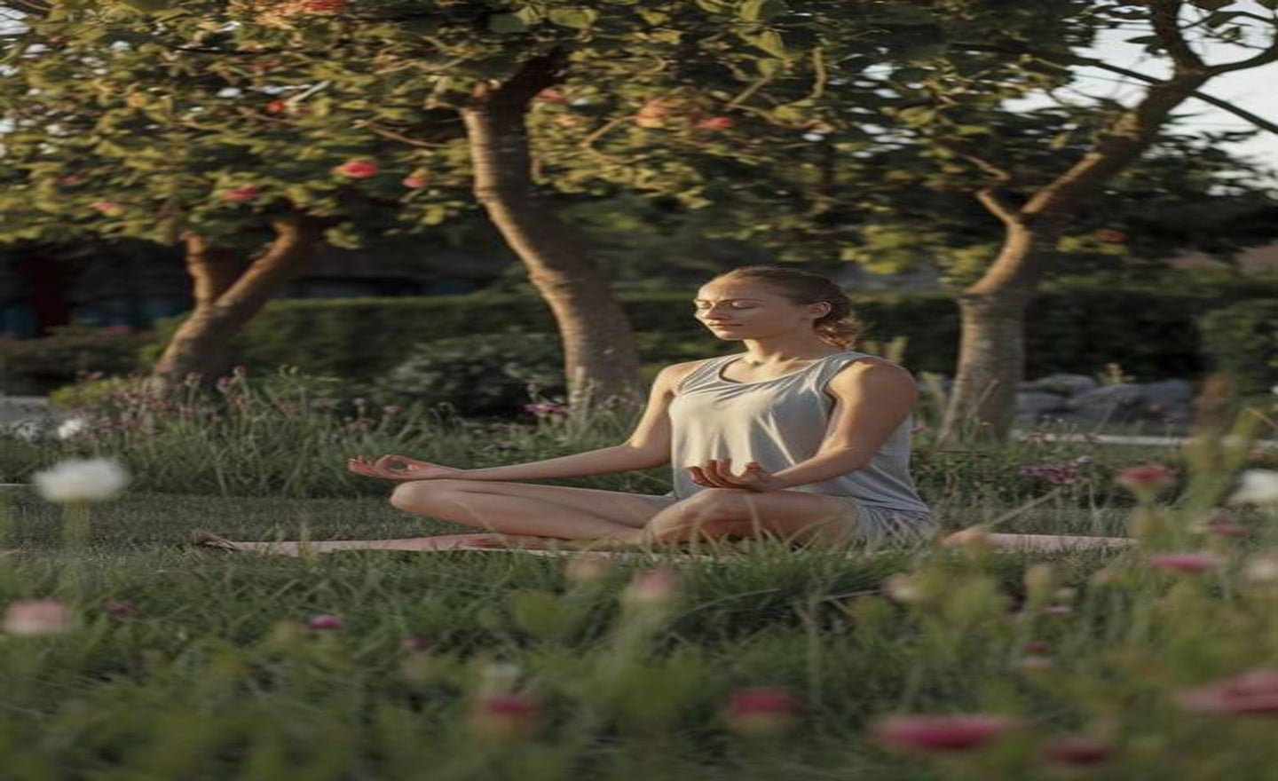 Woman meditating in a garden